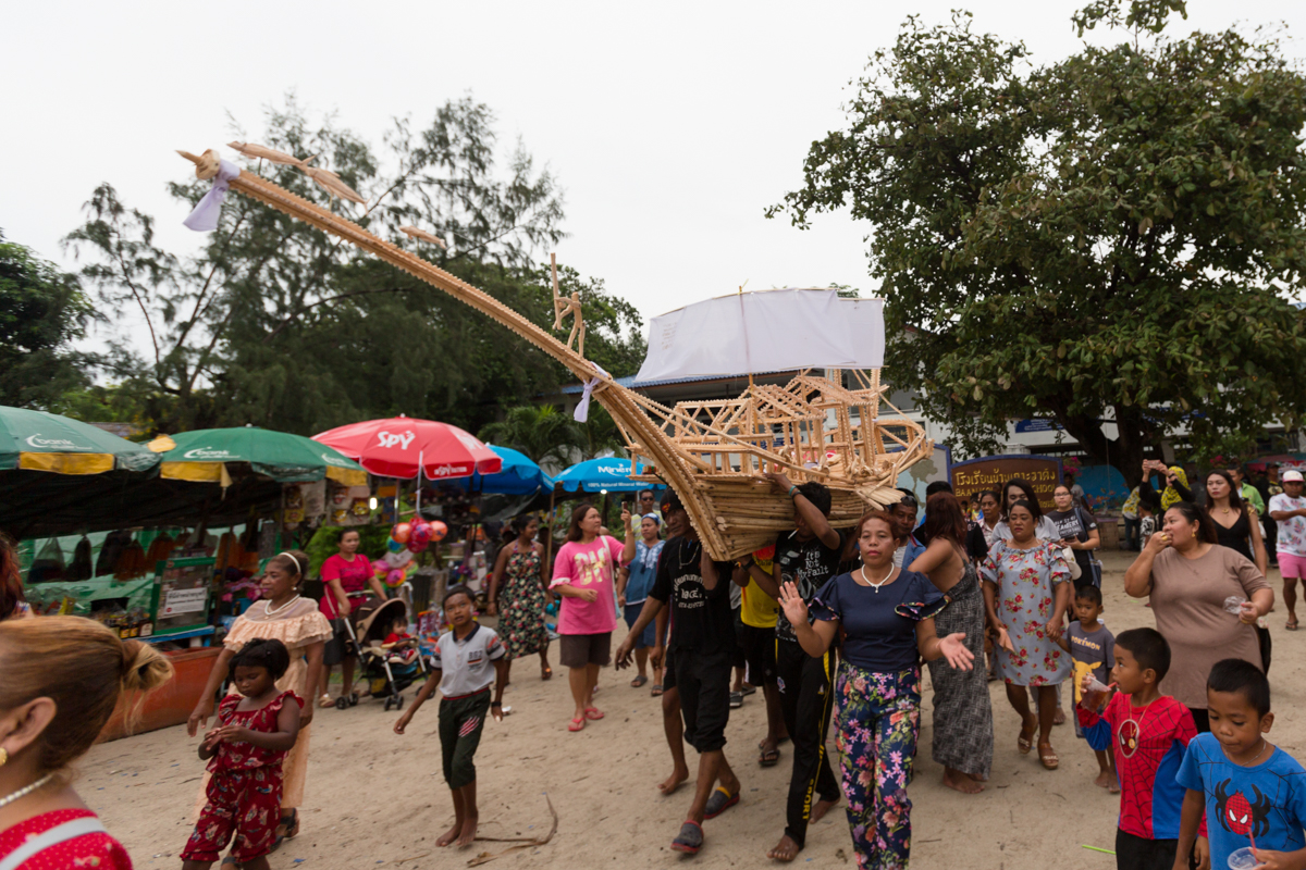 carrying the ceremonial boat