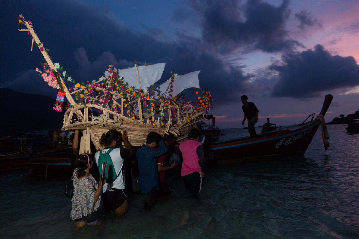 carrying the ceremonial boat